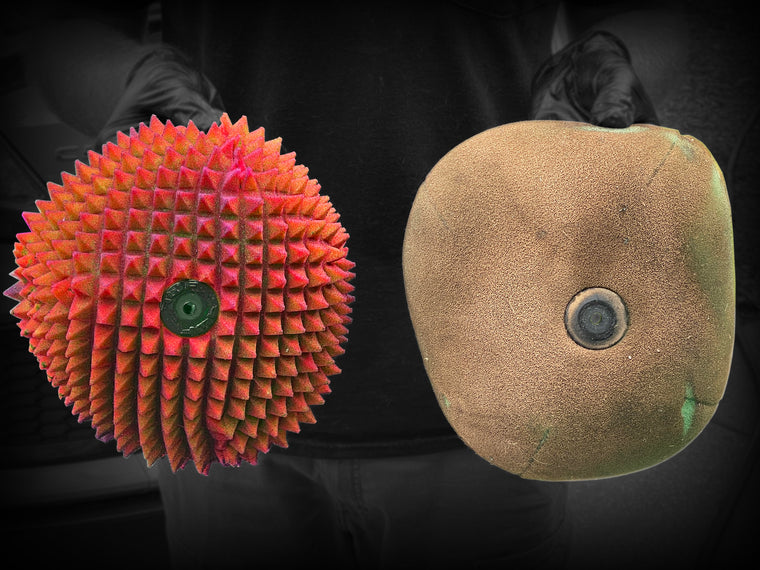 Side-by-side after the same race: FunnelWeb filter still clean-breathing, competitor filter caked with dirt
